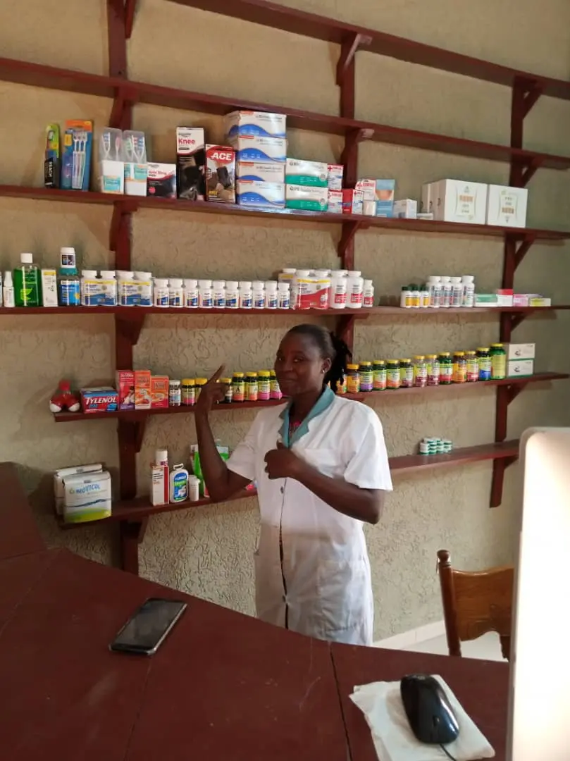 A local healthcare worker with essential medicines